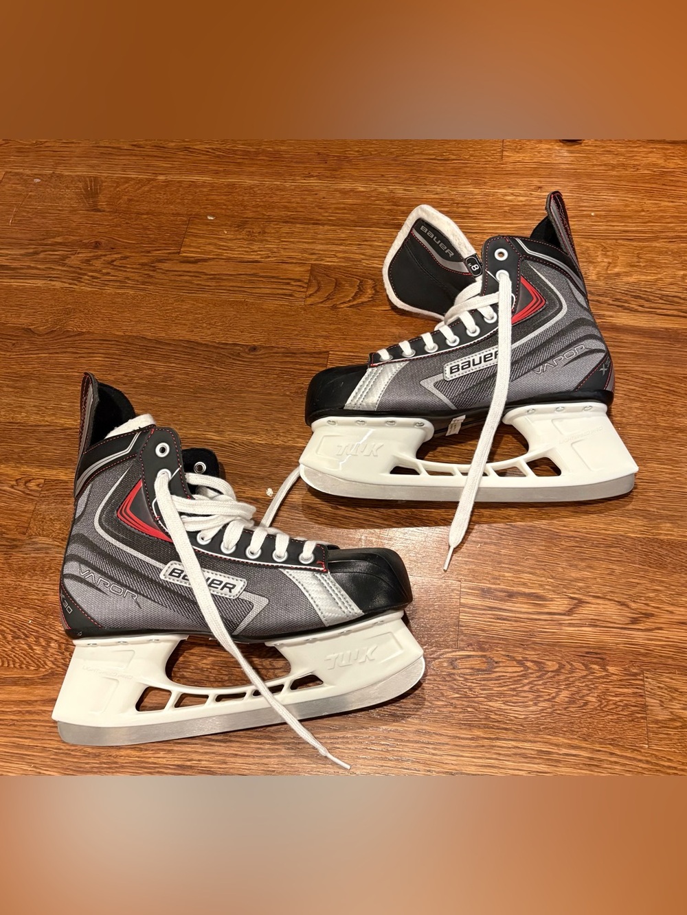 Bauer Gray and Black Hockey Skates with Red Accents